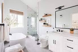 All white bath remodel featuring flat screen TV