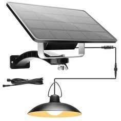 Solar panel with hanging light fixture