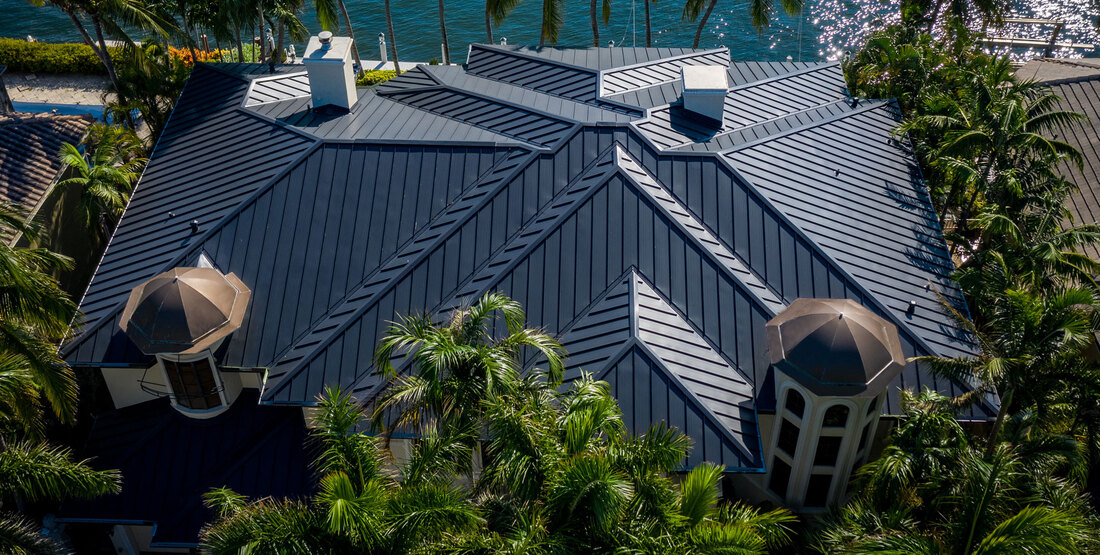 view of rooftop featuring blue clay tiles