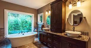 Bathroom featuring oval tub by picture window