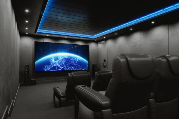 Darkened home theater featuring blue cieling accent lighting