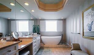 bath remodel with oval tub and ceiling fixture