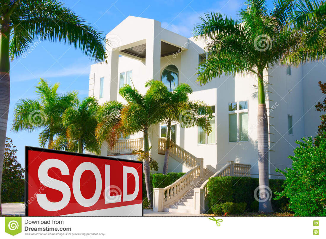 Sold sign in front of Florida condo units