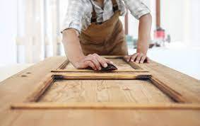 Carpenter sanding door frame